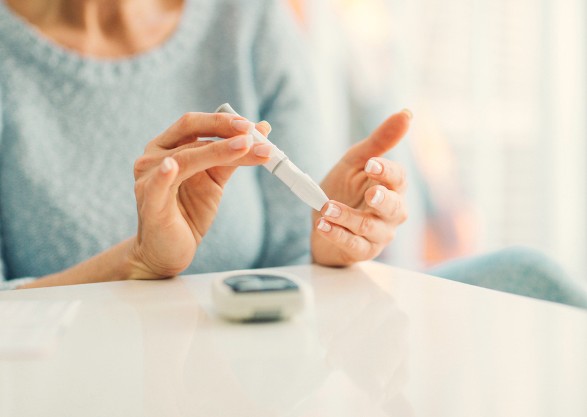 Woman walking on a tree-lined path